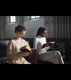 two-young-women-sitting-bench-church-reading-bible-mass_236854-30988 (1) (1)